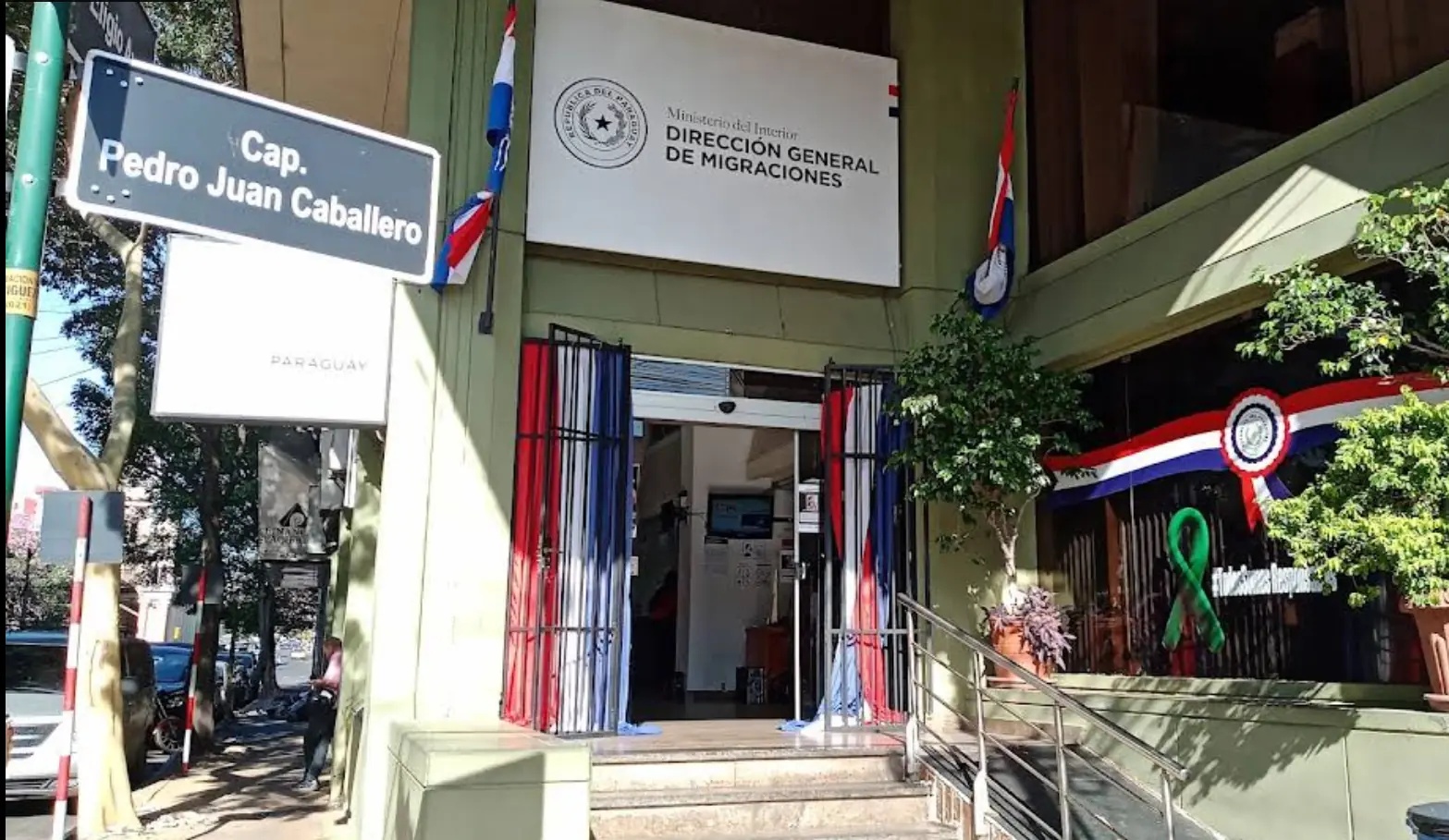 Entrance of the Dirección Nacional de Migraciones in Asunción — the building where conversion files are submitted